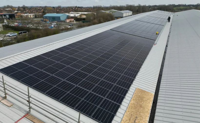 Solar PV panels installed along a commercial roof