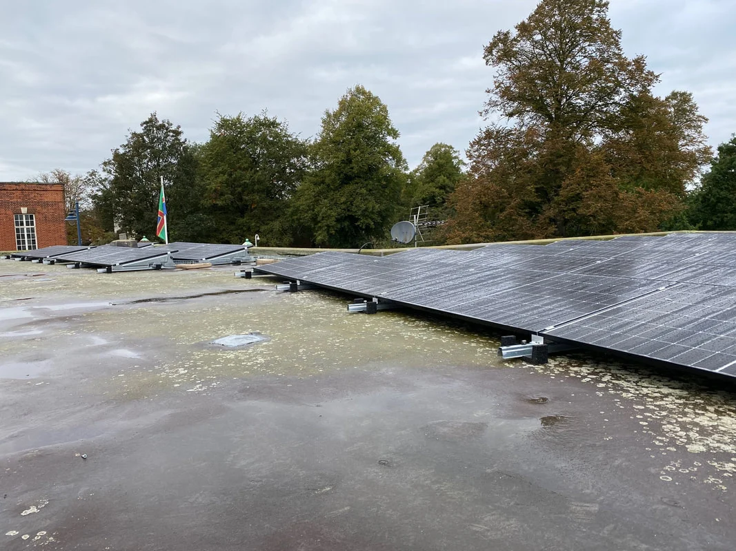 Solar PV panels mounted on a flat roof